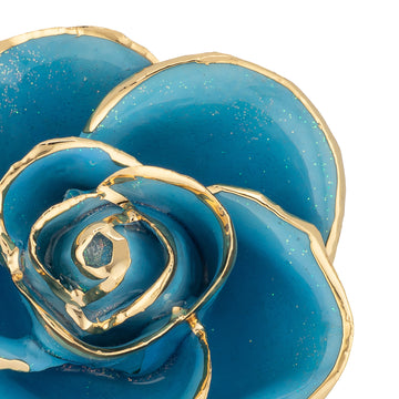 24K Gold Trimmed Forever Rose with Frozen Blue Petals with sparkles suspended in the finish. View of Stem, Leaves, and Rose Petals and Showing Detail of Gold Trim